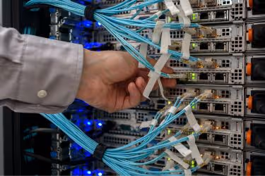 Hand connecting some cables