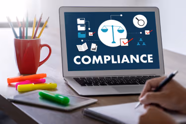 Laptop with an image of compliance