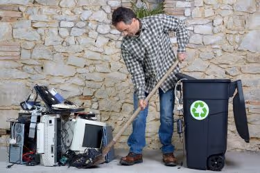 Man recycling electronics