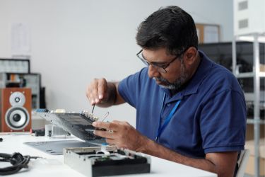 Man repairing a computer