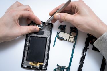Man disassembling a phone