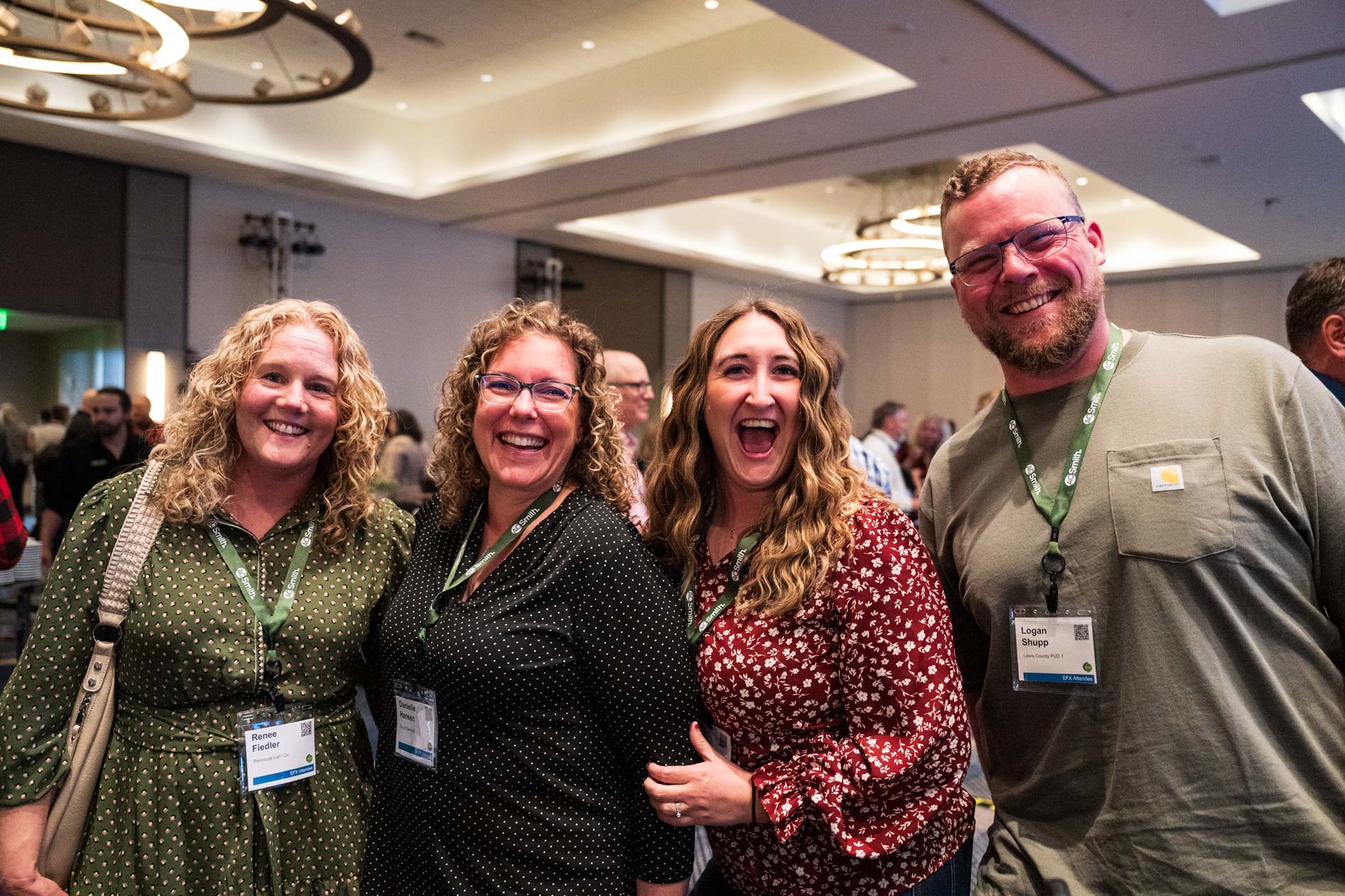 friends smile together at an industry conference in Southeast Portland