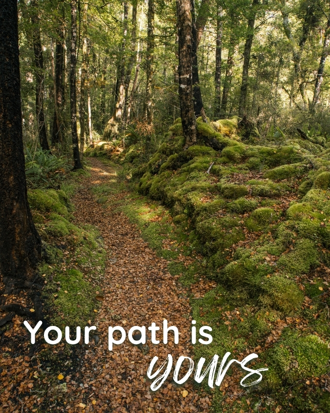 Leaf-covered track through mossy New Zealand bush with the words: Your path is yours