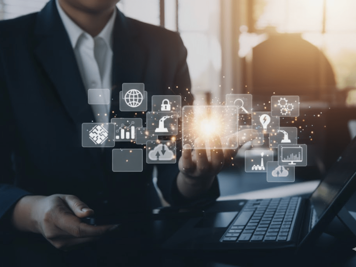 Business technology leader holding digital innovation icons, representing fractional CTO services that guide startups with technical strategy, architecture, and product direction.