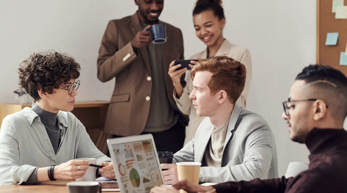 entrepreneurs at an ai startup debating different pr agencies