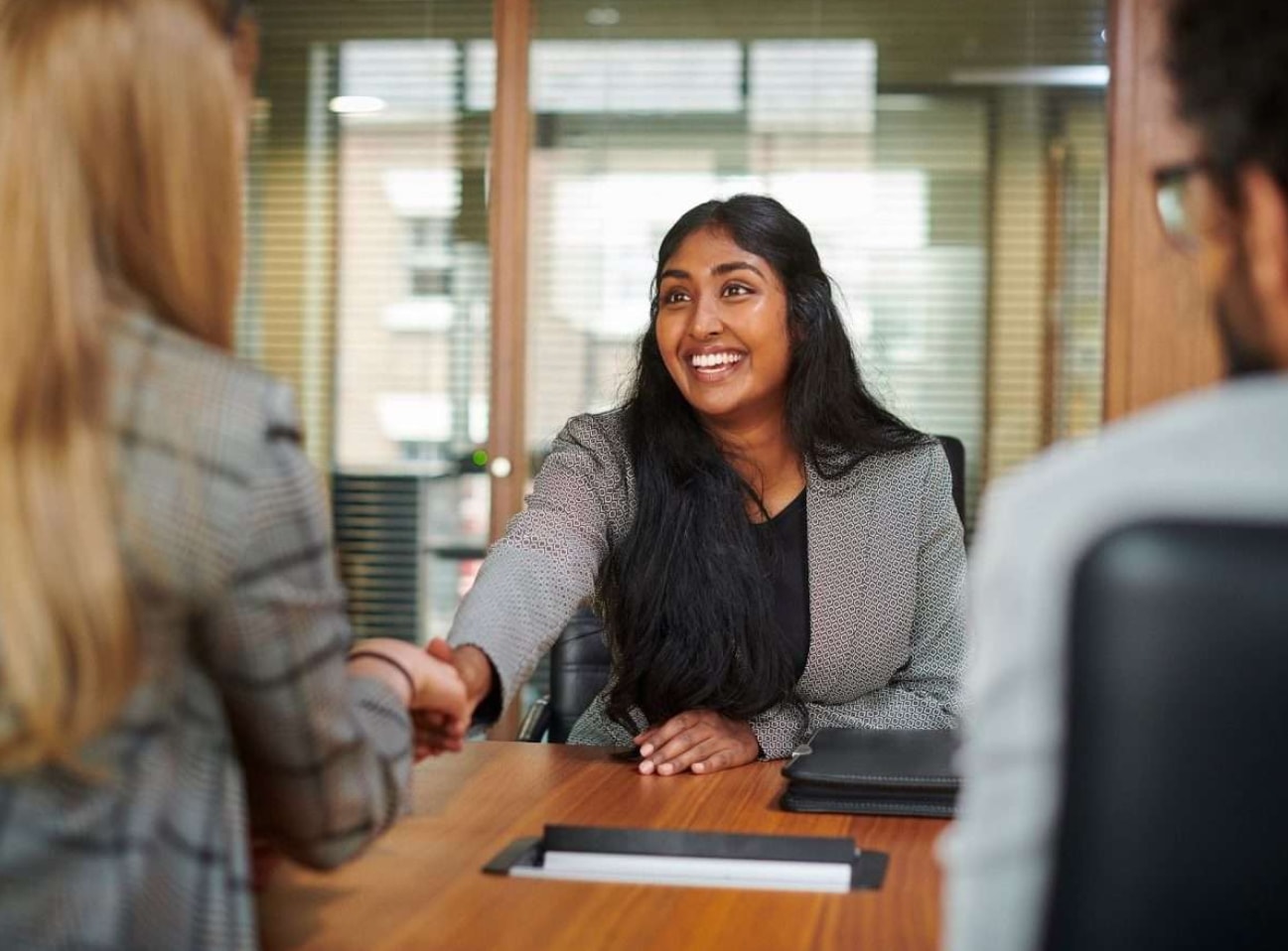 entrepreneur shaking hands with their new AI-business focused PR agents