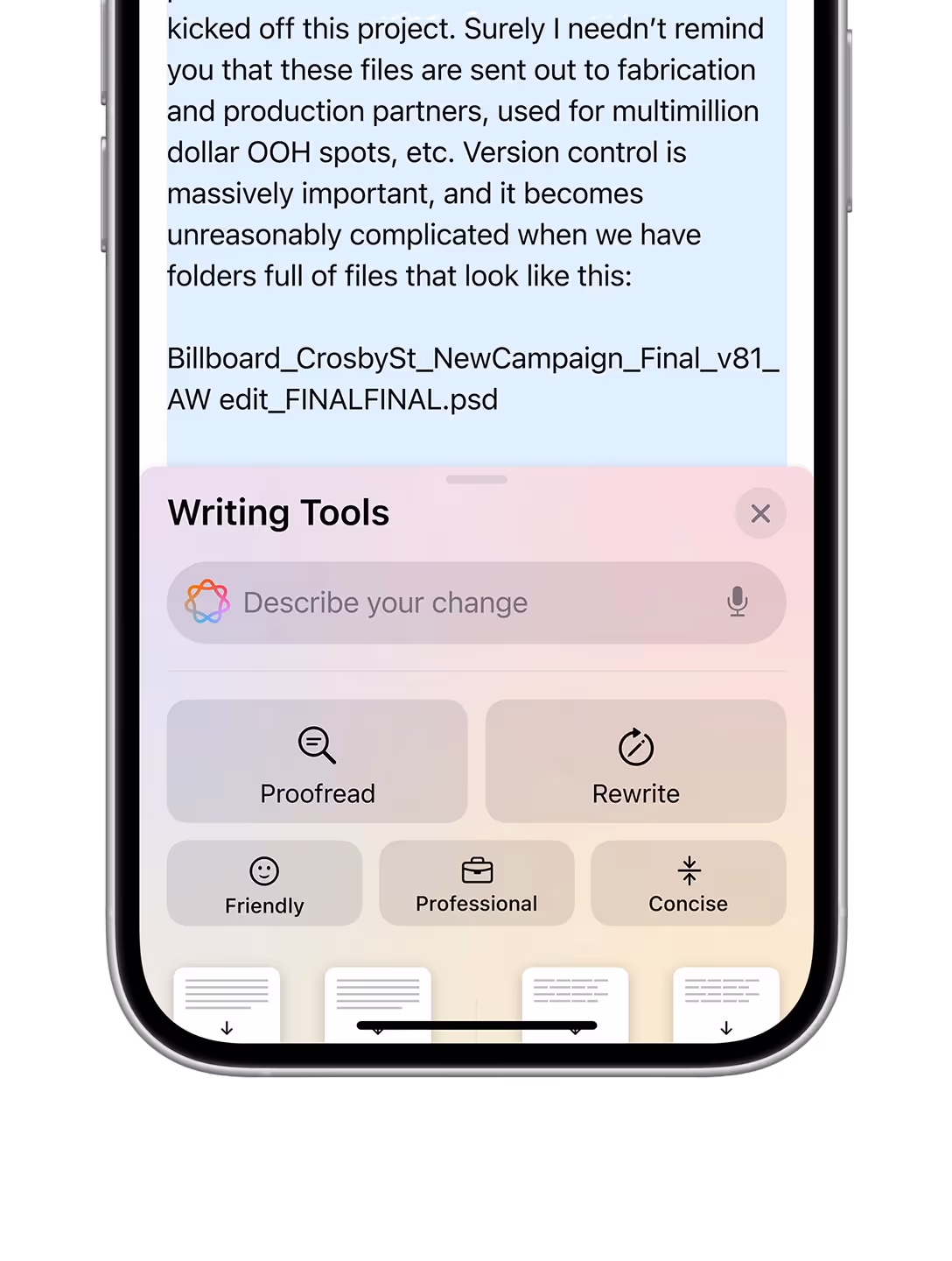 An iPhone showing AI making suggestions to an email.