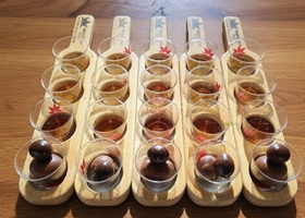 Male syrup tasting at Maple Leaf Place