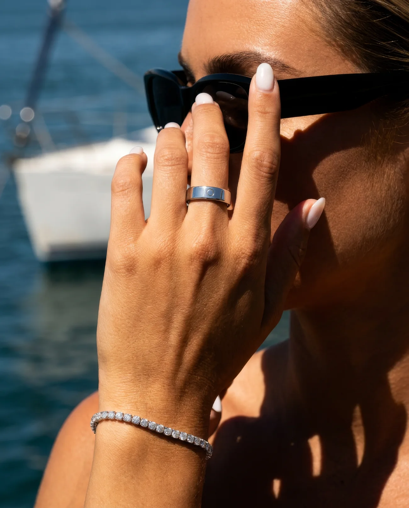 Circular Ring 3 Slim in Silver, worn on the water