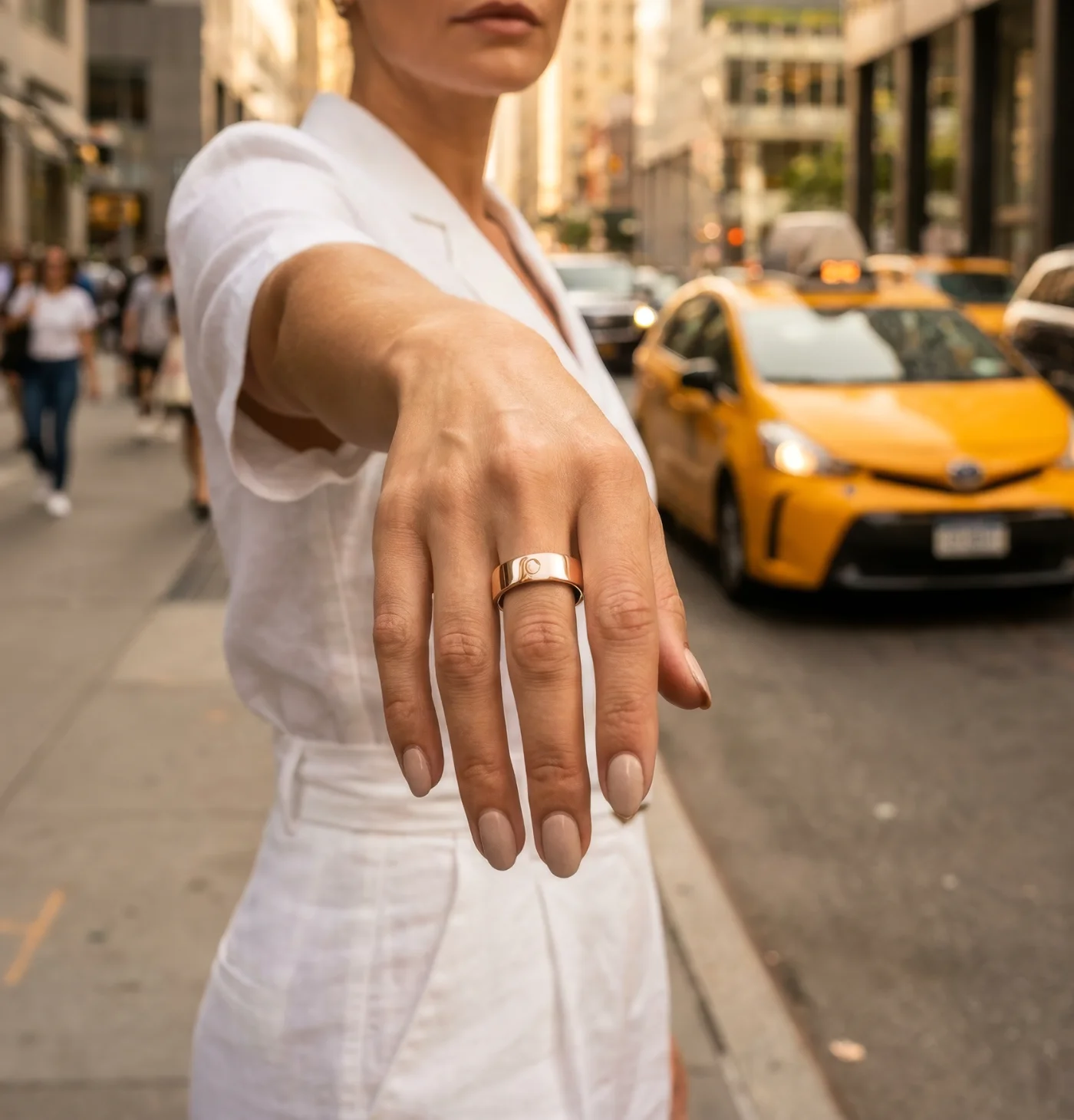 Circular Ring 3 Pro in Rose Gold, worn hailing a taxi in the city