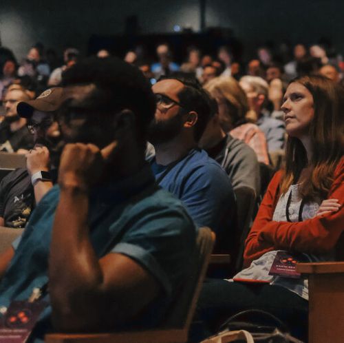 crowd listening to talks in the theater