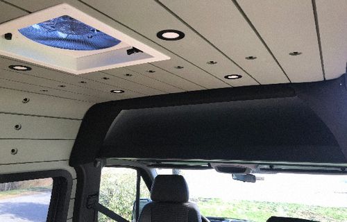 Custom interior of a sprinter van shiplap ceiling.