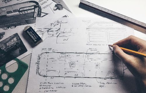 My hand sketching an airstream floorplan.