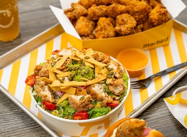 Trays of Starbird Chicken menu offerings