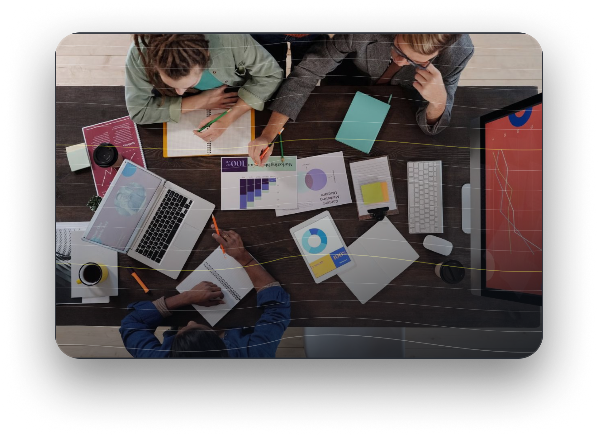 Bank team reviewing performance charts and reports to align messaging across channels