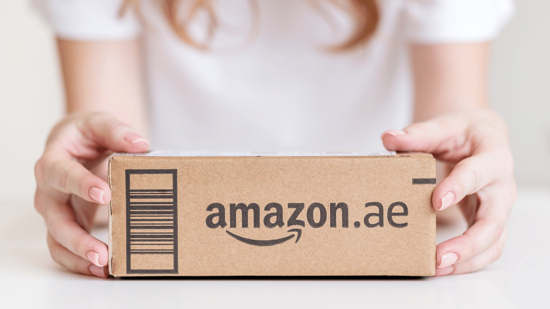Woman holding a package from Amazon