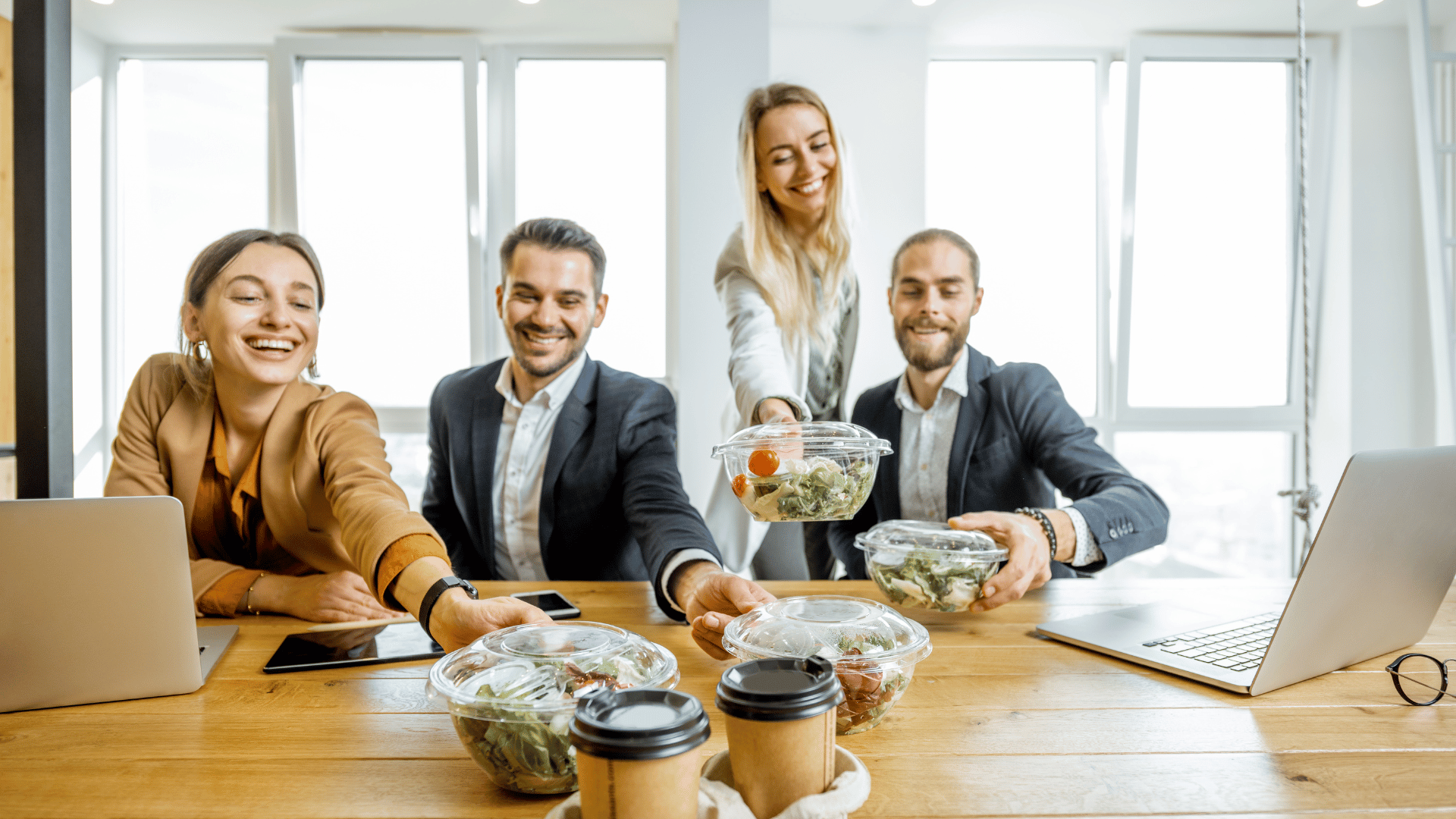 Workers eating lunch at the office