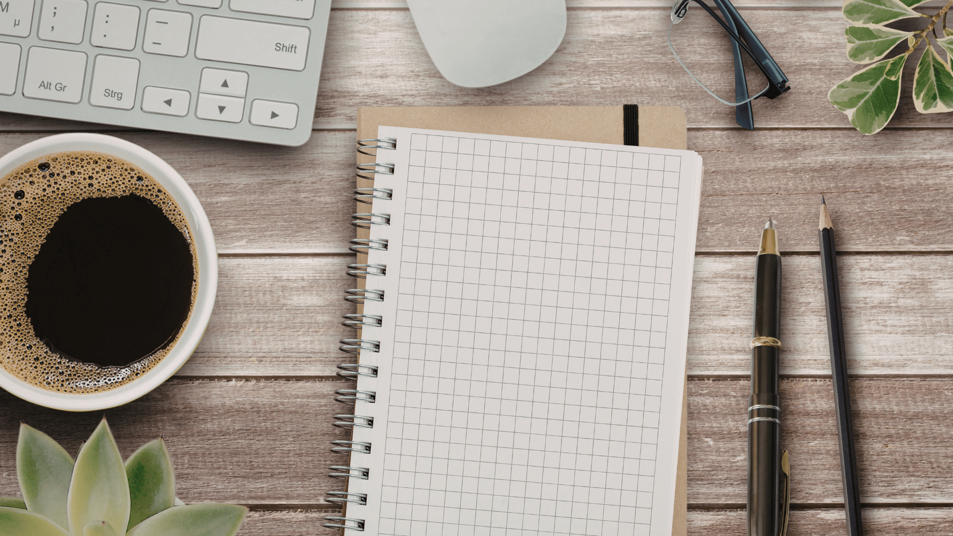 Desk accessories laid out on a wooden table