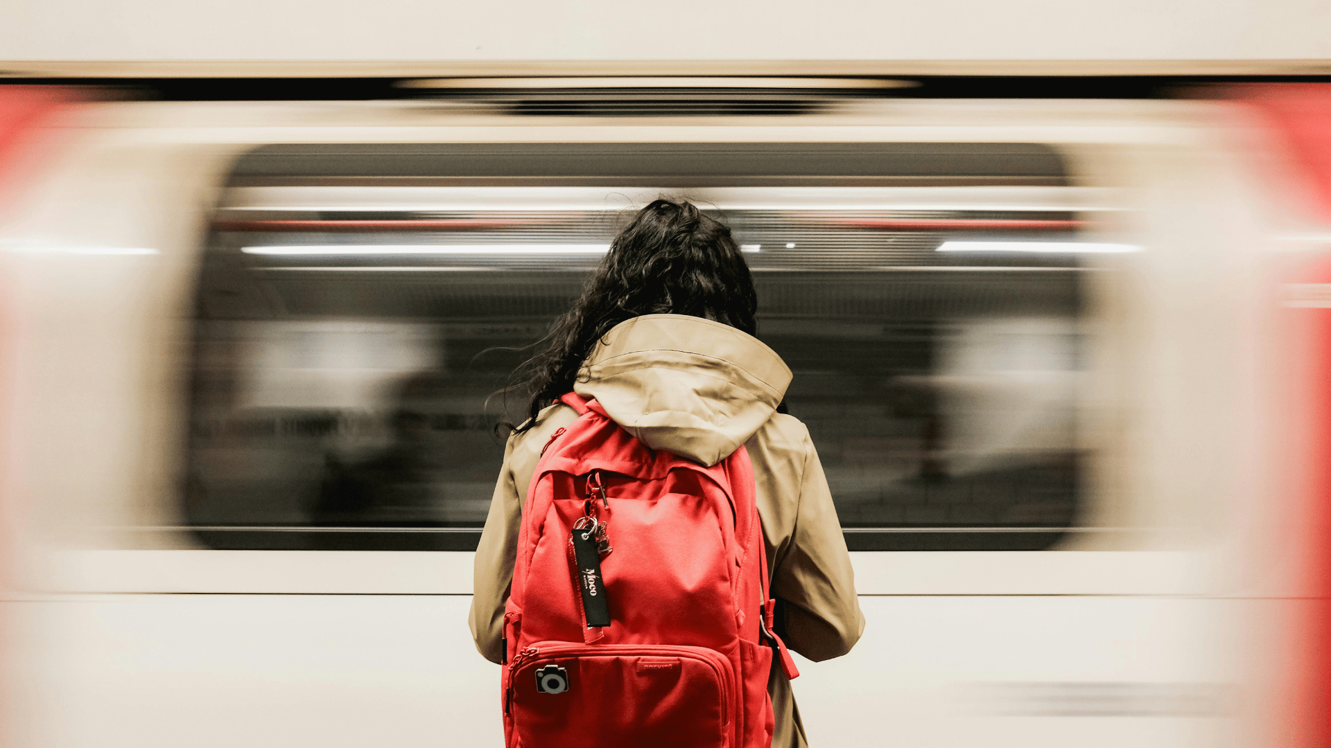 Woman with a backpack on in the subway