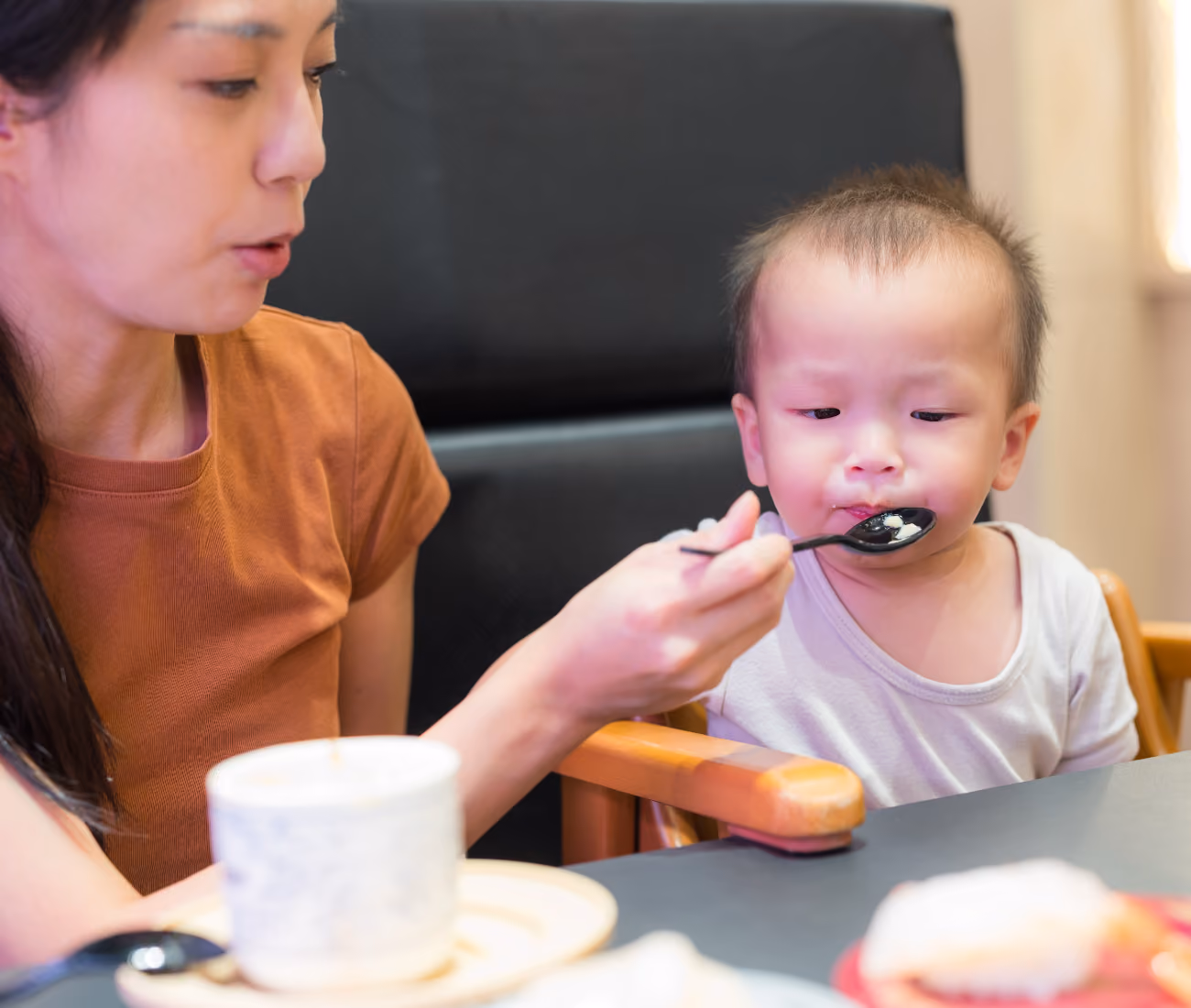 A mother and baby at an Aspire Allergy & Sinus First Bite Friday appointment