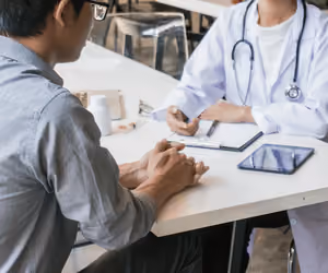 Patient speaking with doctor regarding medication
