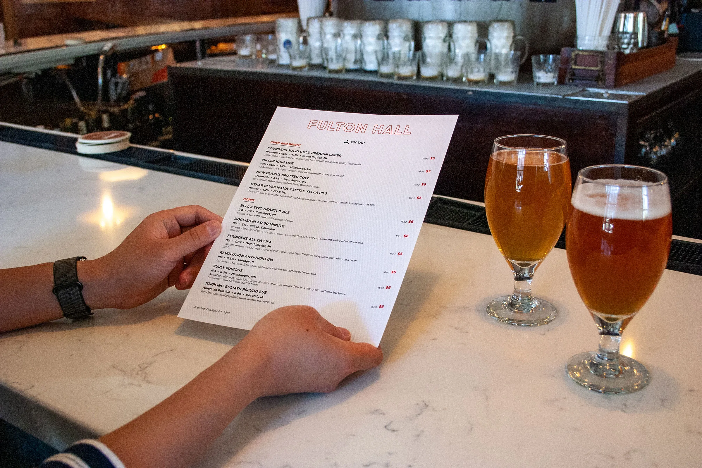BeerMenus print menu photographed in a bar