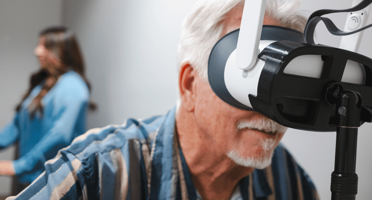 A man takes a Virtual Field test while a tech reviews the results.