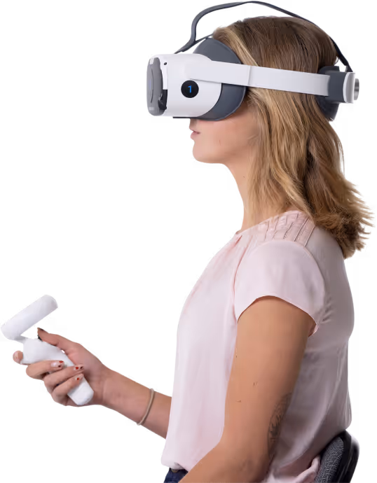 A side profile of a seated woman in a pink shirt taking a Virtual Field test