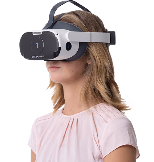 A blonde woman with a pink short wearing the Virtual Field Pro headset