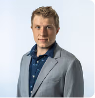 A man in a shirt and suit jacket 