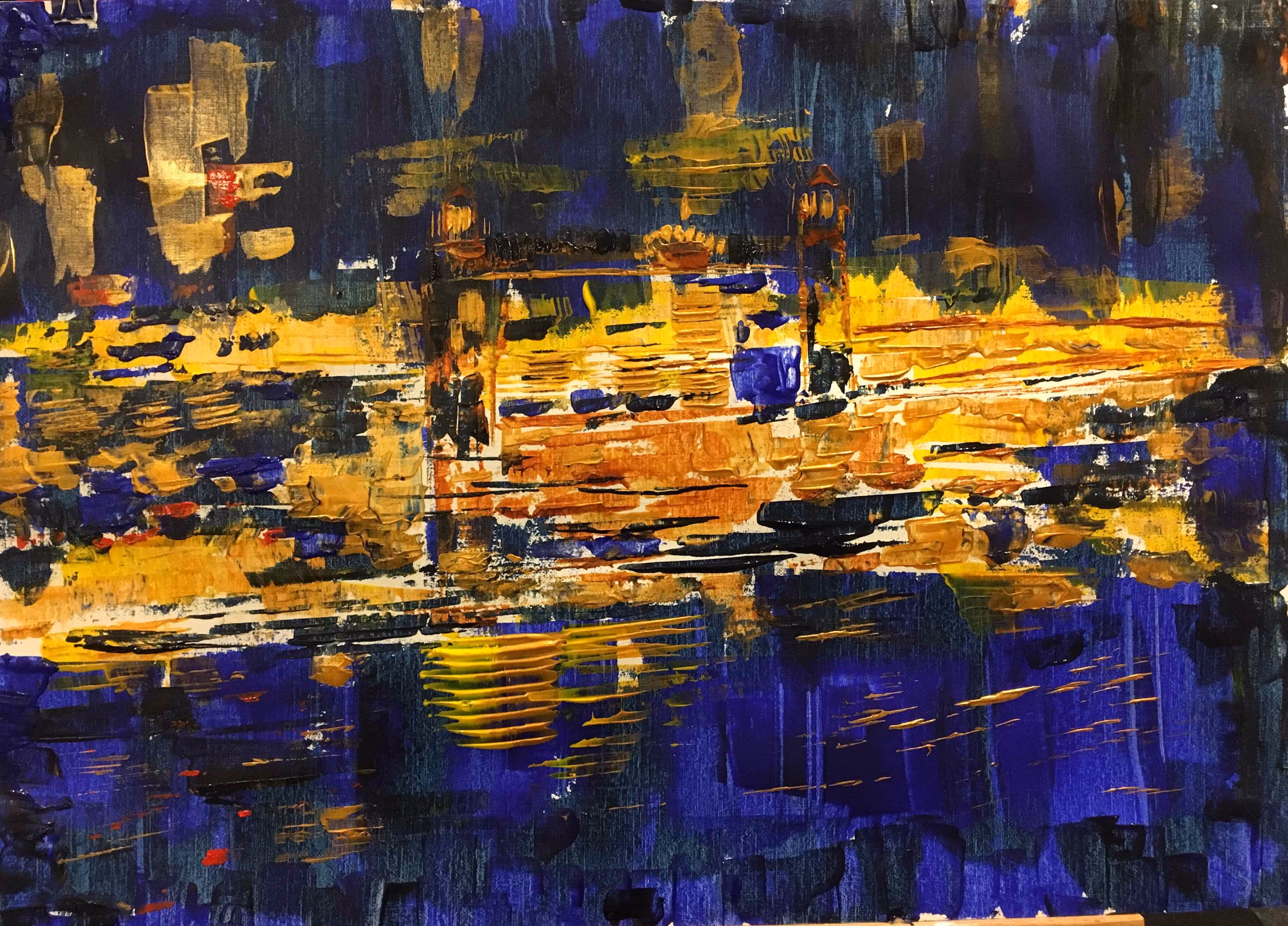 Clear reflection of golden flecks in a deep blue lake at night