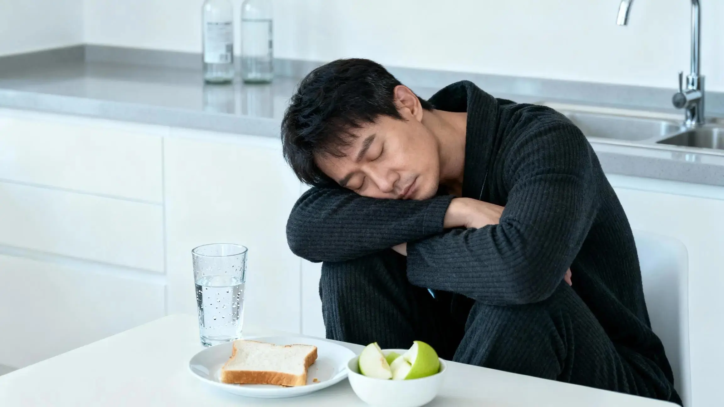 Person holding head with weary expression, illustrating symptoms of a 5 day hangover and recovery tips