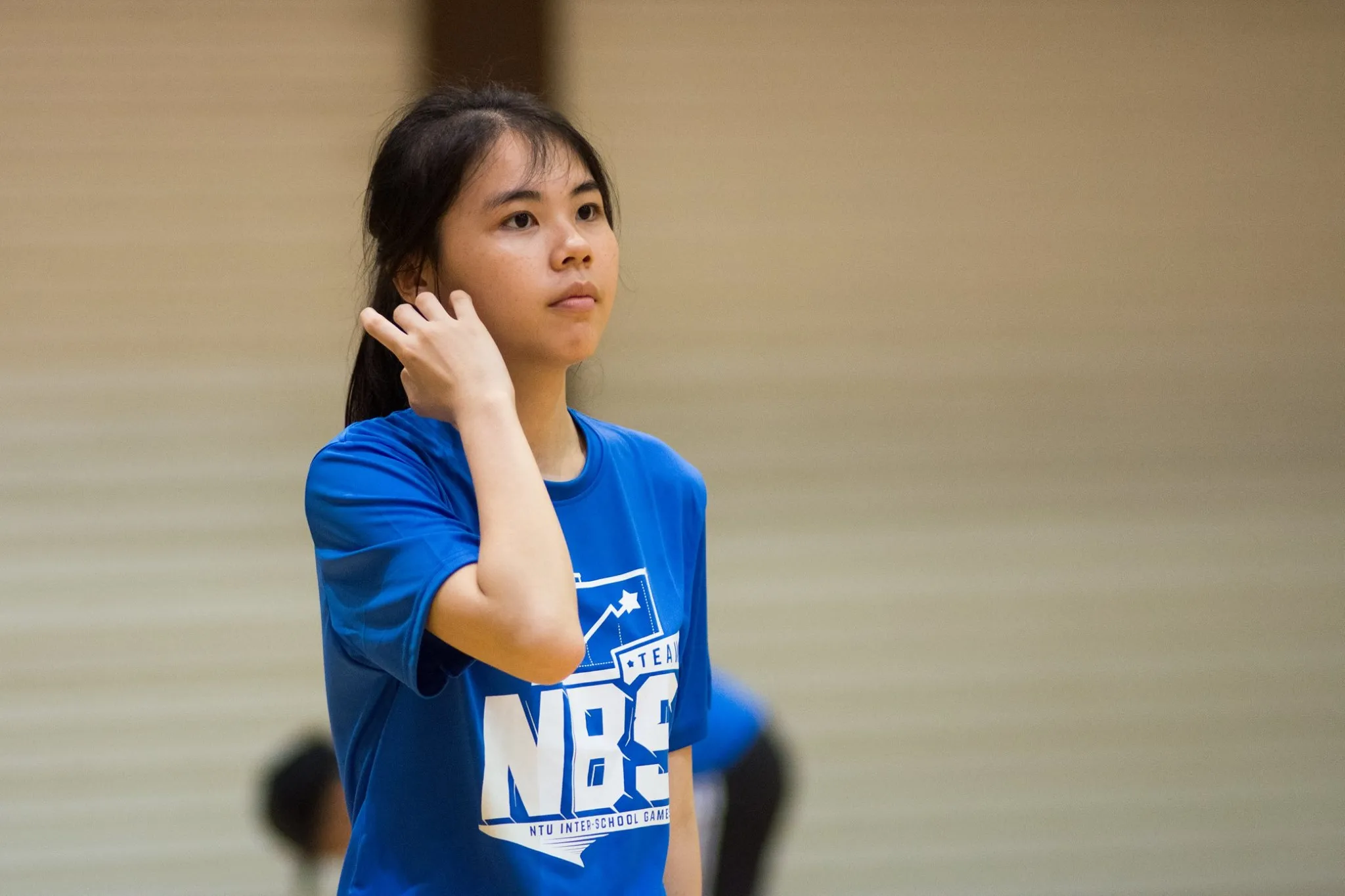 A girl wearing NBS design shirt