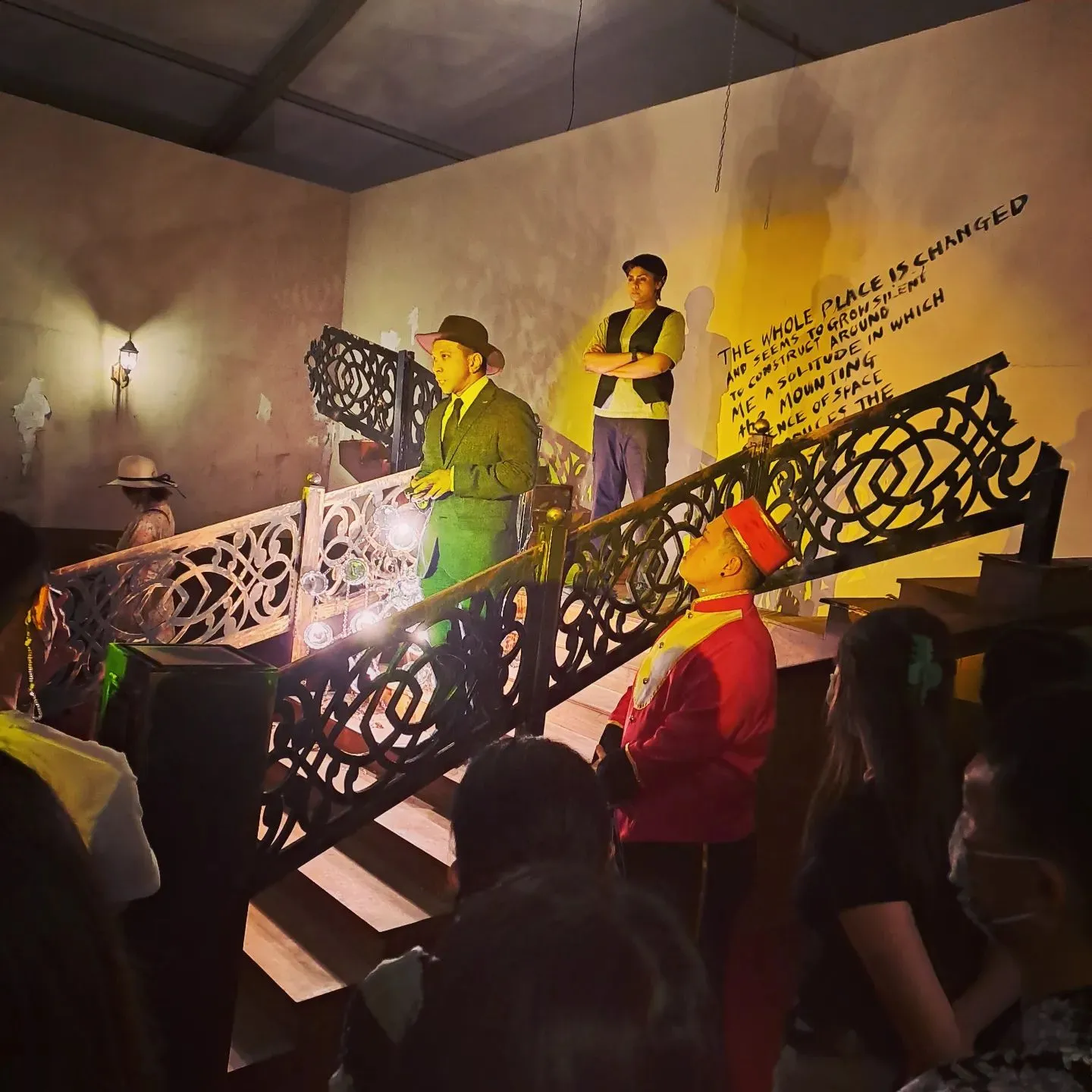 a group of people standing on top of a set of stairs