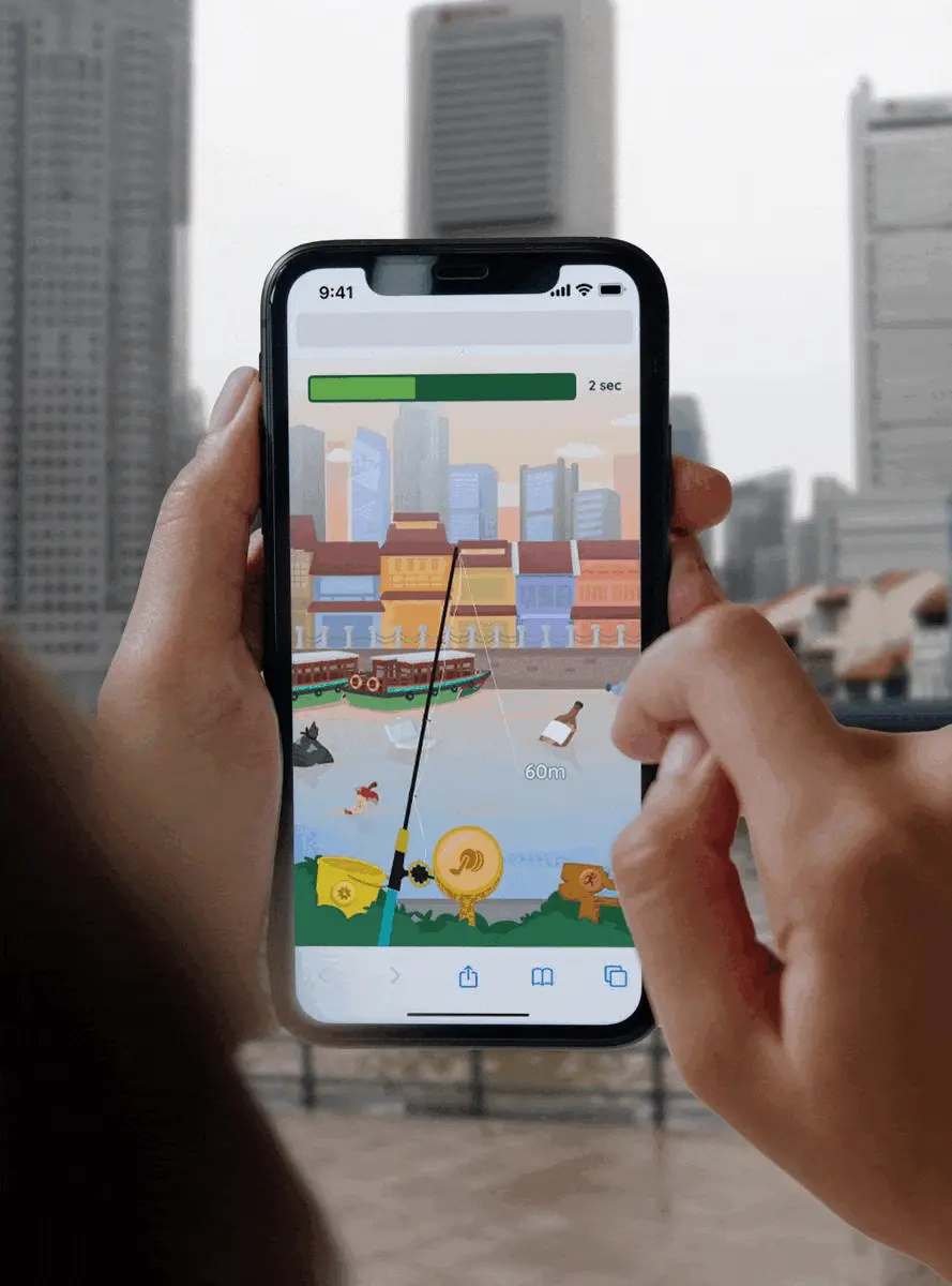 a person holding a cell phone with a game on the screen