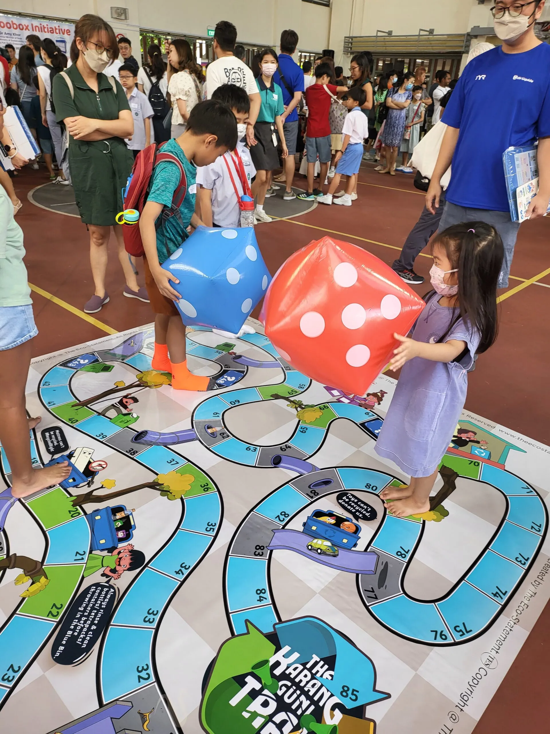 Kids playing with the life-sized board game