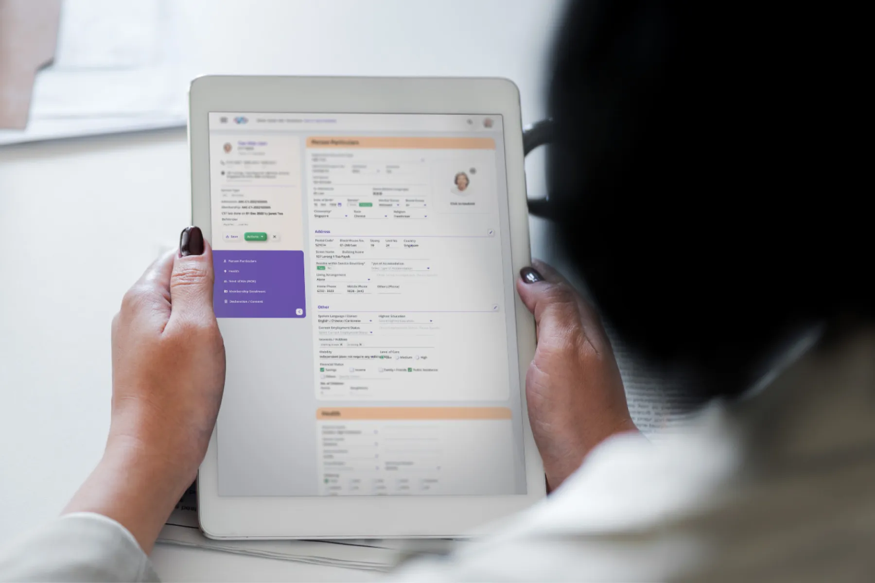 A nurse using the IngotPCC system with a tablet