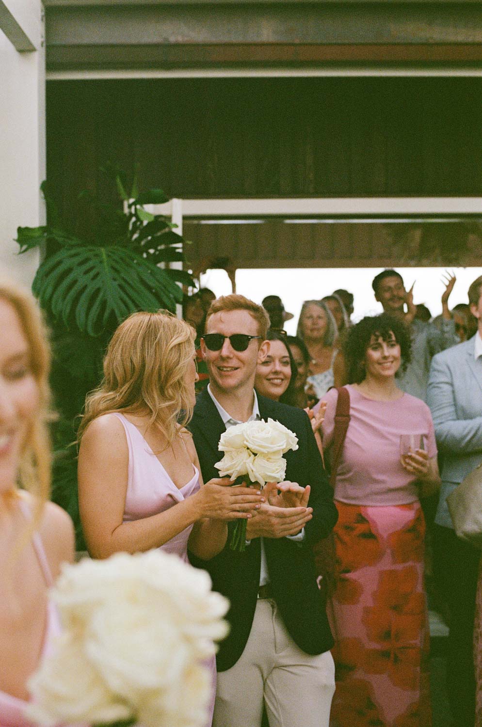 Wedding guests chatting shot on film
