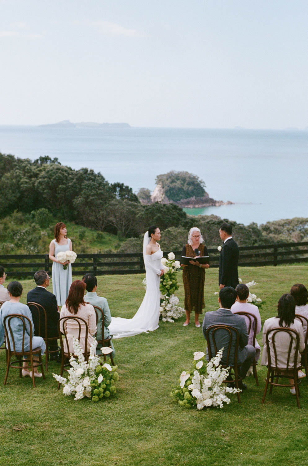 35mm film photo of a wedding ceremony at Hillbrook Estate overlooking the ocean.