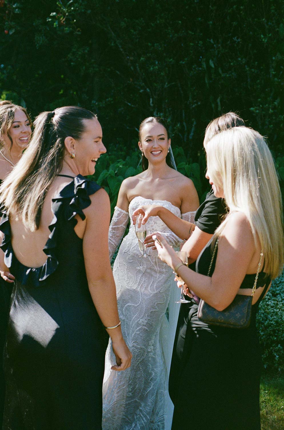 Bride laughing with friends