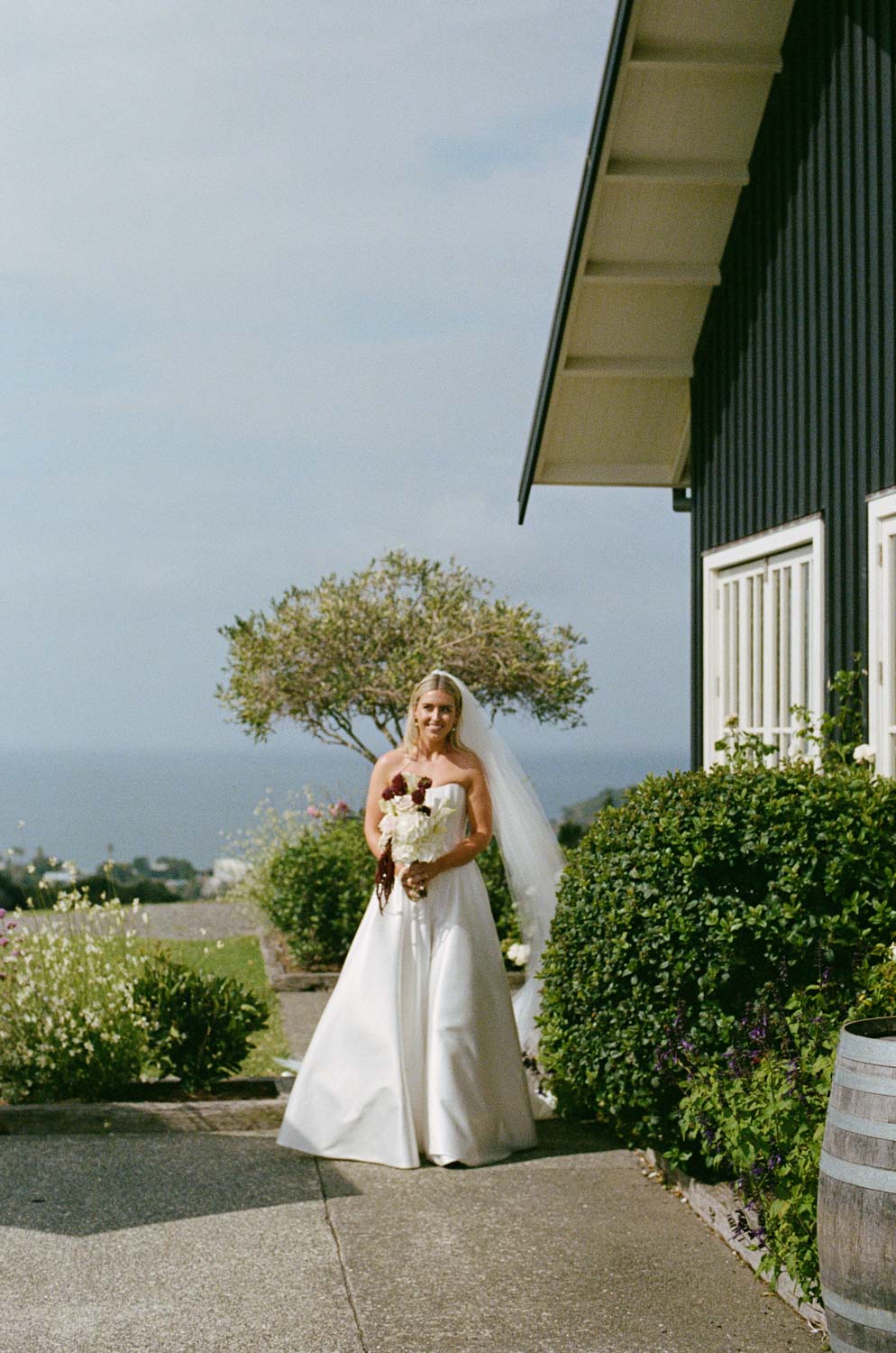 Film photo of bride walking in at Mudbrick Waiheke Island