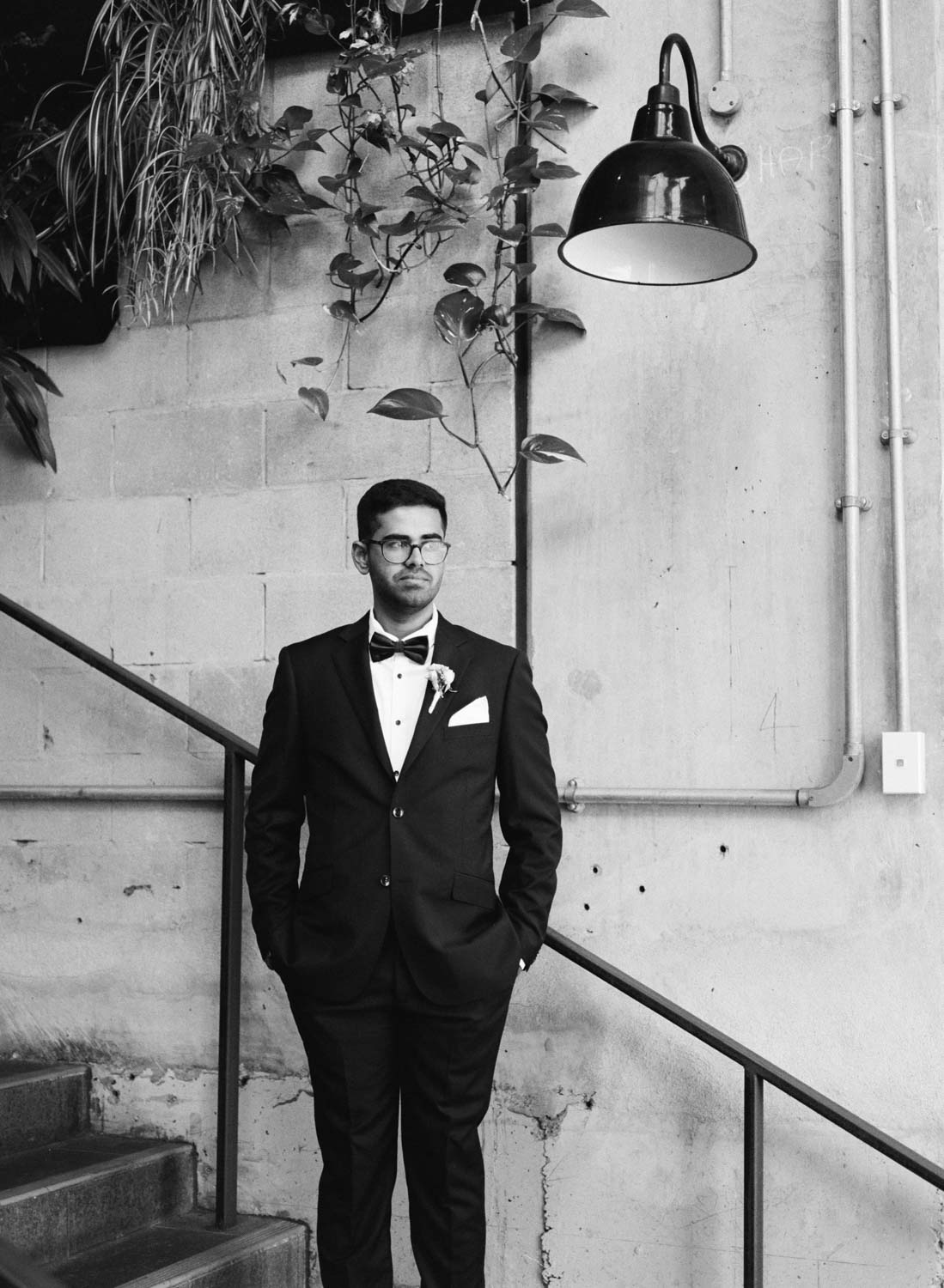 Black and white film portrait of groom