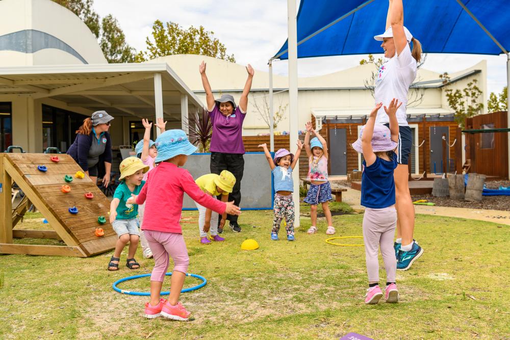 A class of kids at PE doing activities from the KIDDO program