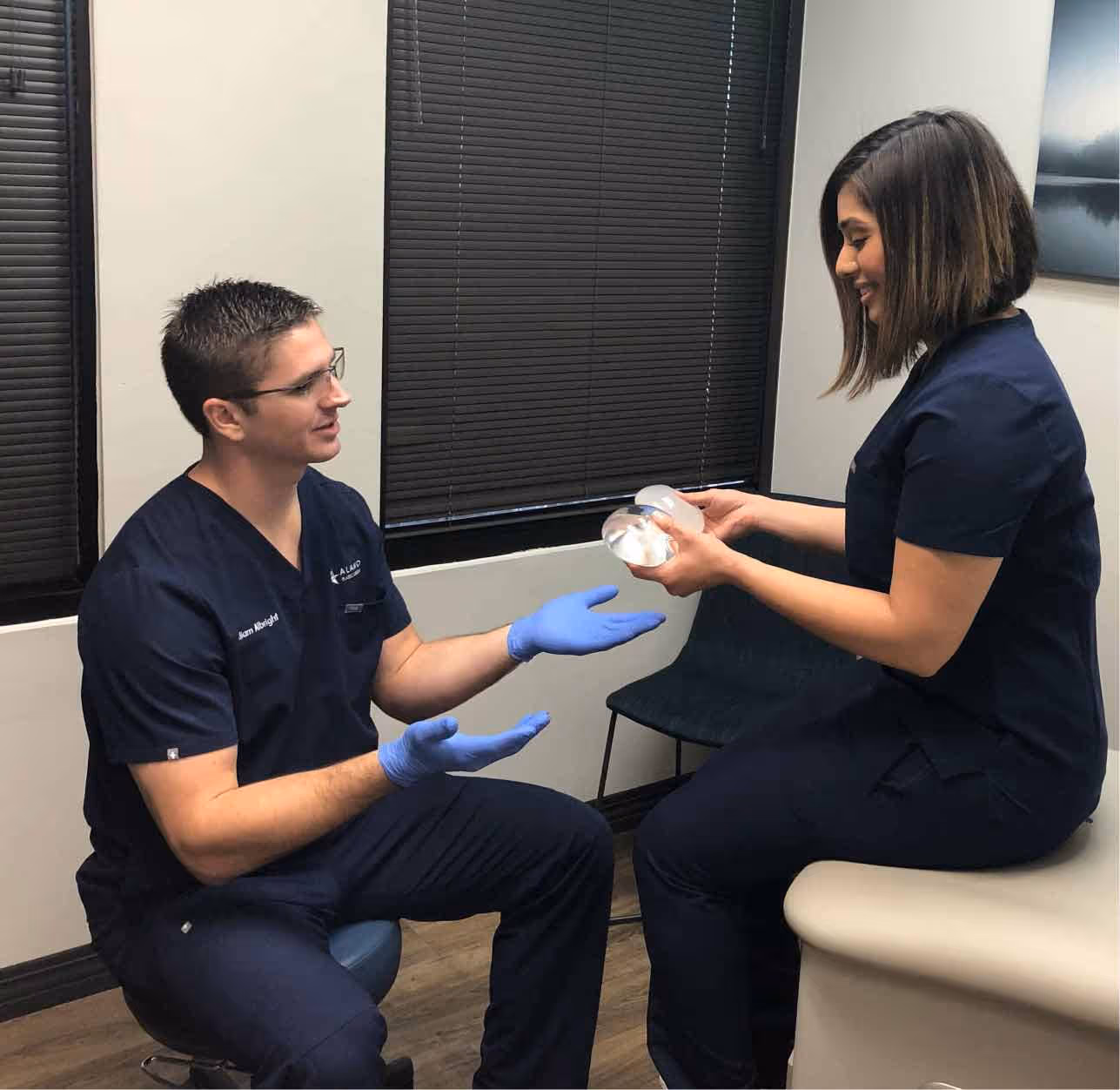 Dr. William Albright taking implants from a nurse