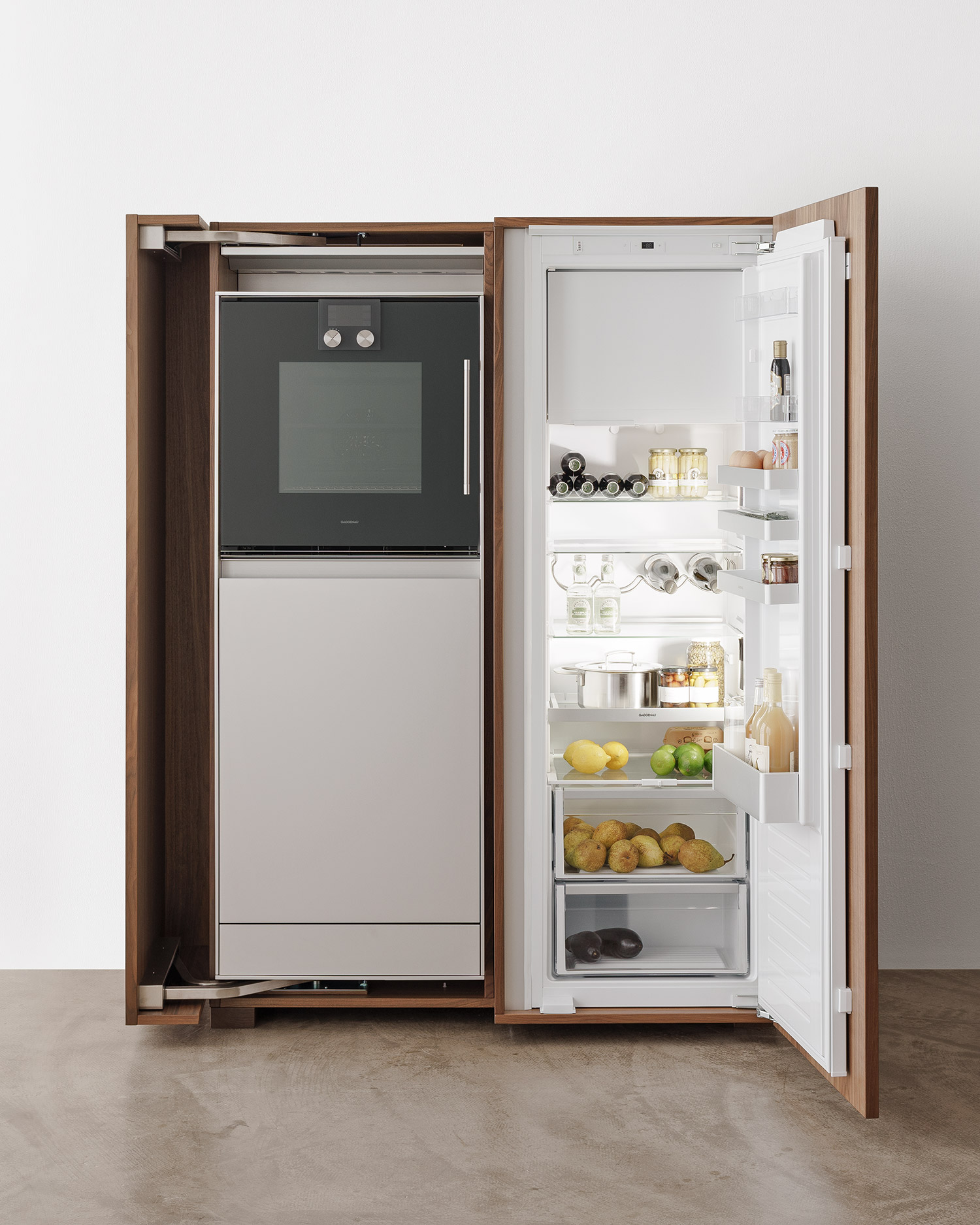 b2 kitchen appliance cabinet by Bulthaup open to show oven, dishwasher and fridge freezer
