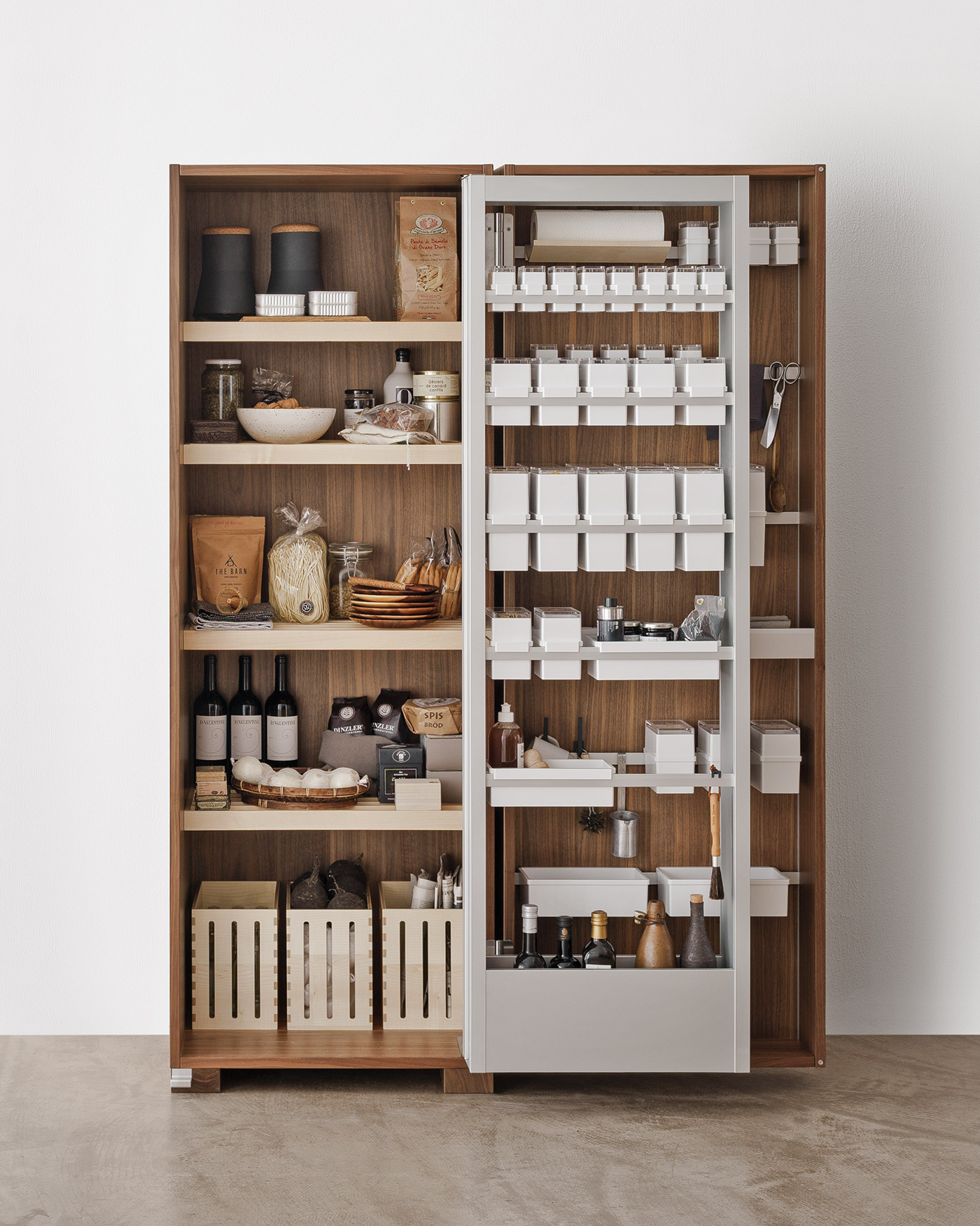 kitchen tool cabinet in walnut wood with holding rails, rods, hooks, knife boards and additional internal metal door to give three layers of storage in one cabinet