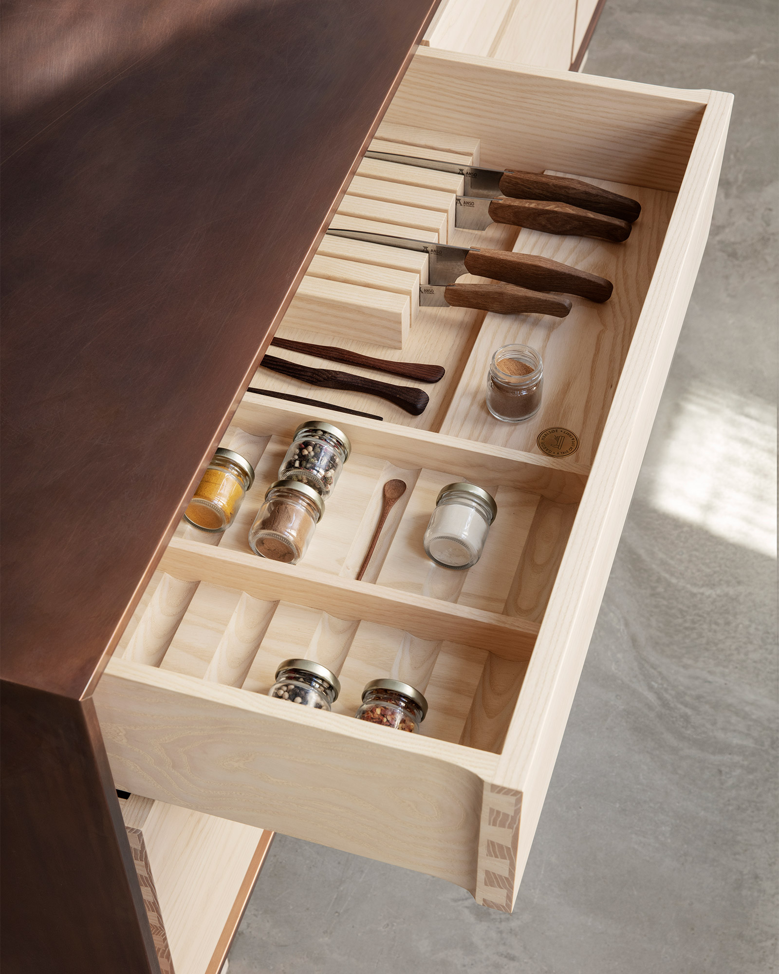 Kitchen storage drawer made of ash wood with dovetail joints