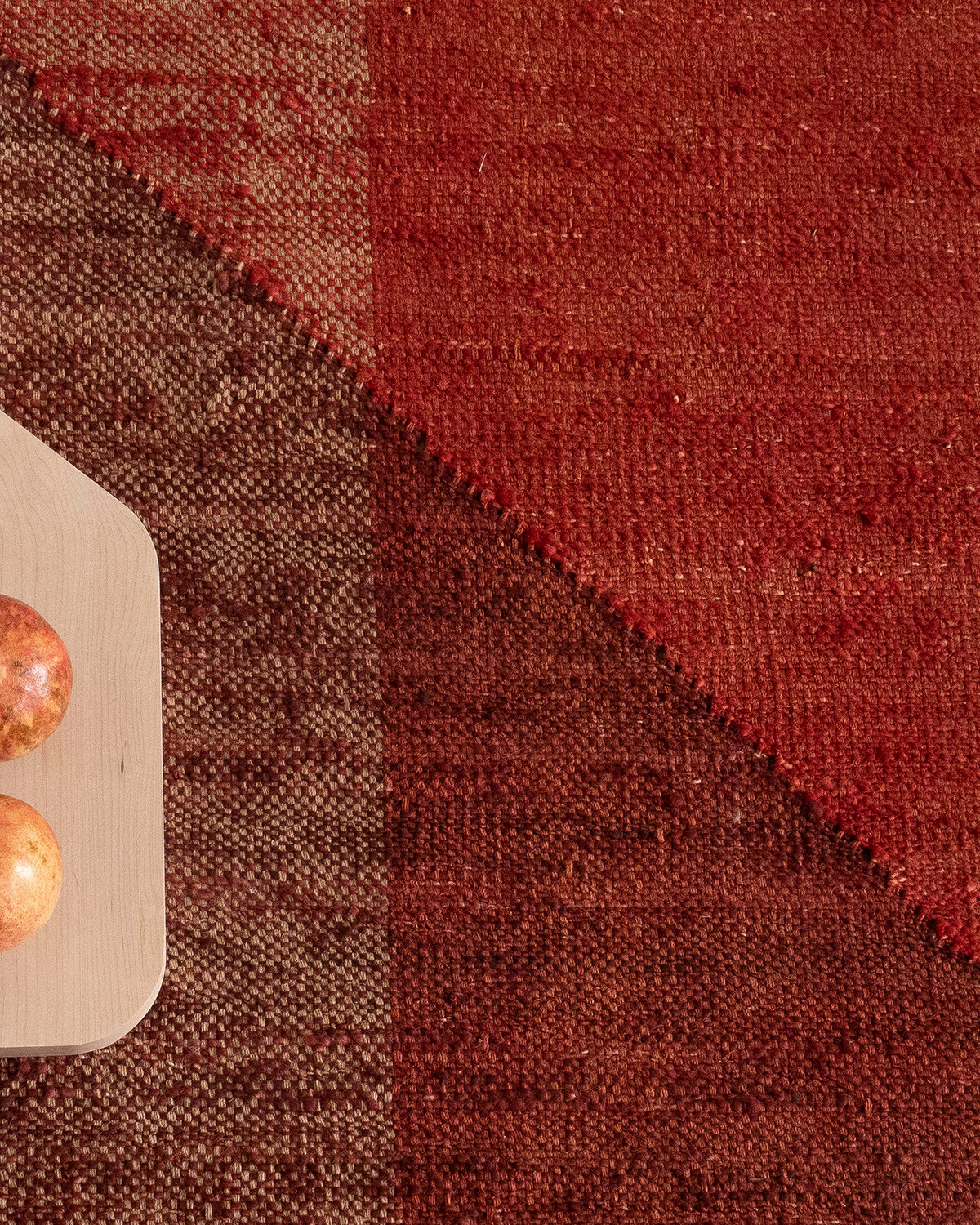 red and burgundy geometric flat woven rug