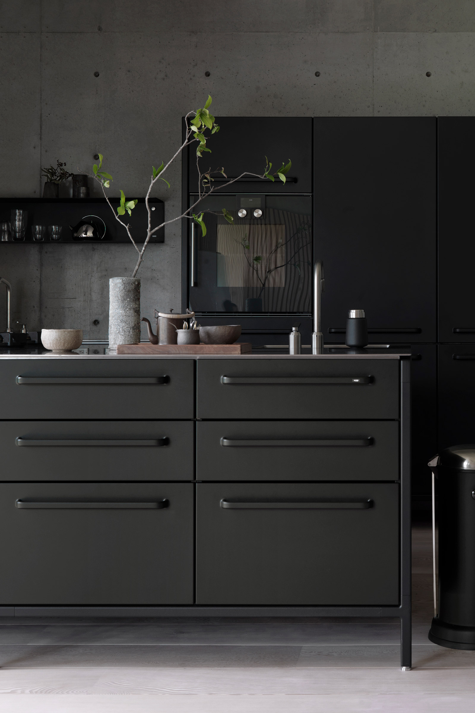 Vipp kitchen against a concrete wall