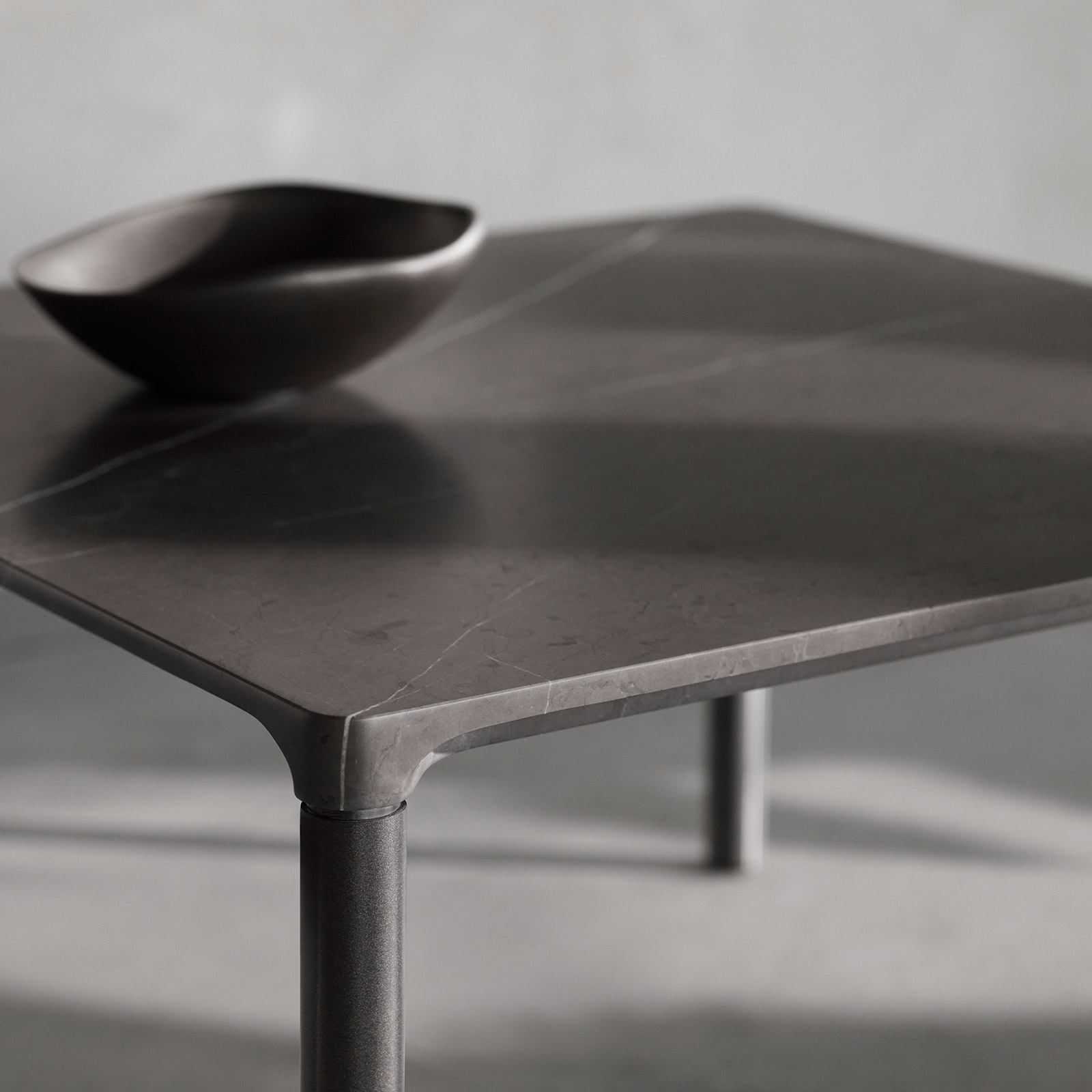 grey marble coffee table and bowl with sunlight and shadows